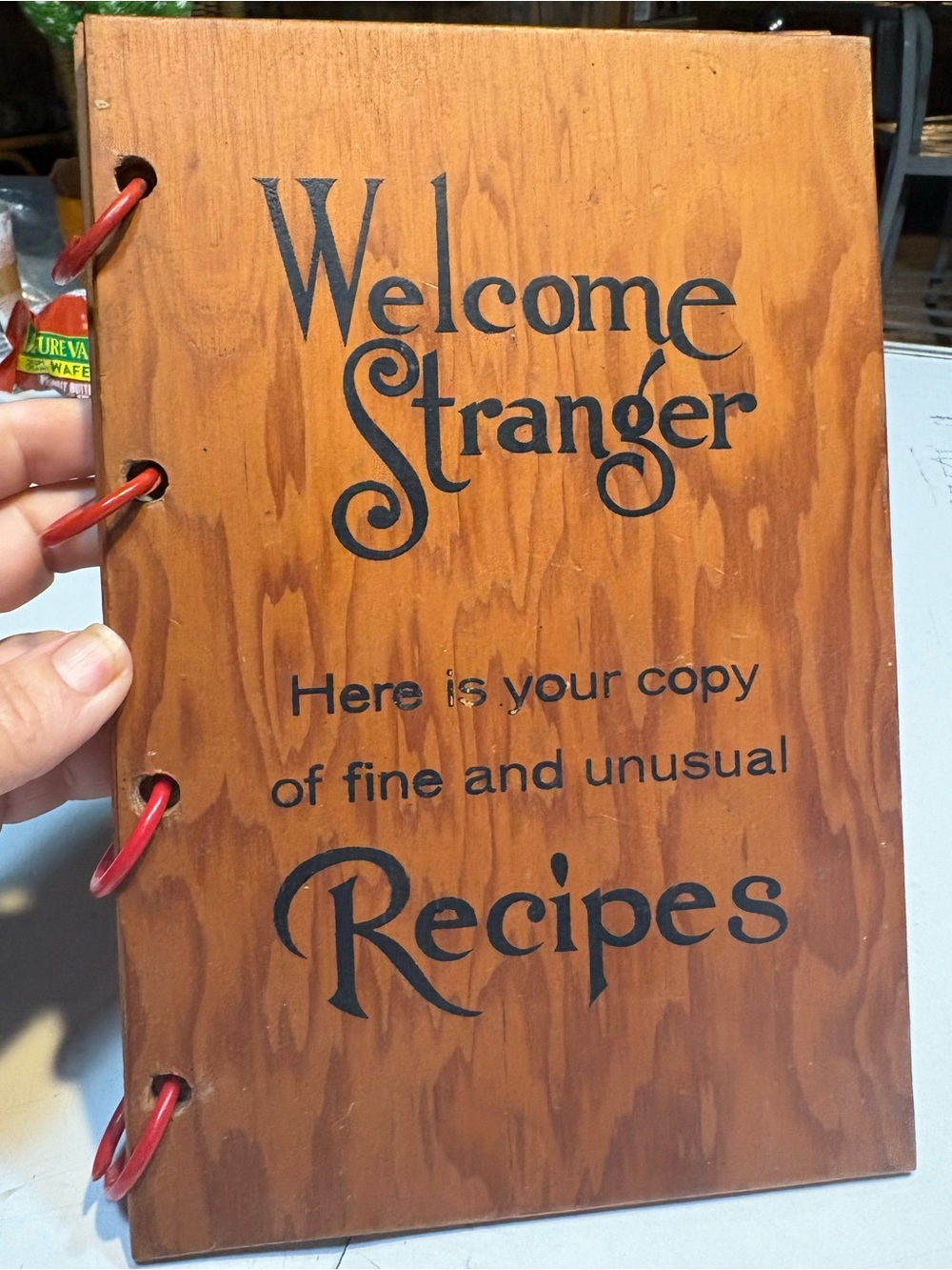 wooden-covered recipe book Welcome Stranger Here is your copy of fine unusual